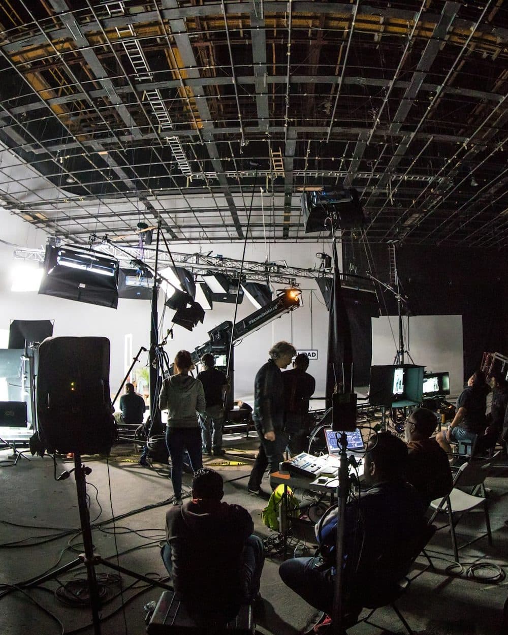 A studio shoot in progress under full lighting